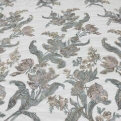 Broderie verde-lila pastel